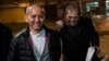 Kazakh opposition figure and oligarch Mukhtar Ablyazov (left), flanked by his lawyers, reacts as he leaves the Fleury-Merogis jail after being released, near Paris, in December 2016.