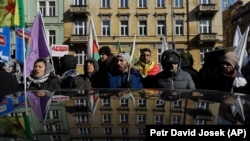 Protesters demonstrate in front of the Interior Ministry in Prague on February 26.