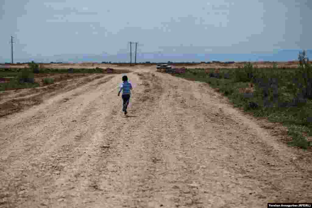 Children, with no easy form of transportation, often sprint the distance between villages. Annagurban said his son, seeing this boy, said, "Dad, Turkmenistan has a long way to go!"