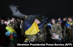 Former Ukrainian POWs meet their relatives after a prisoner exchange last month with Donbas separatists.