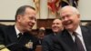 U.S. Defense Secretary Robert Gates (right) and Admiral Mike Mullen share a laugh during a House Armed Services Committee hearing in Washington on February 16.
