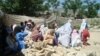 Students of a girls primary school hold class on the rubble of their school in June after it was destroyed by the Pakistani Taliban in Bajaur Agency.