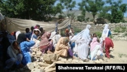 Students of a girls primary school hold class on the rubble of their school in June after it was destroyed by the Pakistani Taliban in Bajaur Agency.