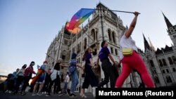 Demonstrators protest in Budapest in June against Hungarian Prime Minister Viktor Orban and a new anti-LGBT law. 