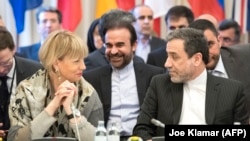 Abbas Araghchi (R), political deputy at the Ministry of Foreign Affairs of Iran, and the Secretary General of the European Union External Action Service (EEAS) Helga Schmid talk as they meet for E3/EU+3 and Iran talks in Vienna. 2018, File photo