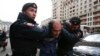 Interior Ministry officers detain a man during a protest against the razing of the Soviet-era apartment blocks outside the State Duma in Moscow on June 14.
