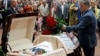 Ukrainian President Petro Poroshenko lays flowers on the coffin containing the body of journalist Pavel Sheremet, who was killed by a car bomb, during a memorial service in Kyiv on July 22.