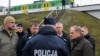 Polish Prime Minister Donald Tusk (right) surveys the site of damaged railway tracks on the Warsaw-Lublin line on November 17 in Mika after an explosion that he called an "unprecedented act of sabotage."