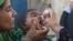 A health worker administers polio vaccine drops to a child during a polio vaccination campaign in Karachi on June 7.