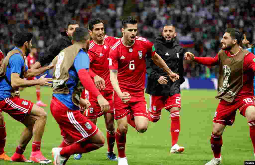 Soccer Football - World Cup - Group B - Iran vs Spain - Kazan Arena, Kazan, Russia - June 20, 2018 Iran's Saeid Ezatolahi celebrates scoring their first goal with team mates before it was disallowed after a VAR review REUTERS/Toru Hanai