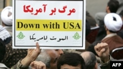 A member of the Basij militia holds an anti-U.S. slogan during a rally outside the former U.S. Embassy in Tehran in November.