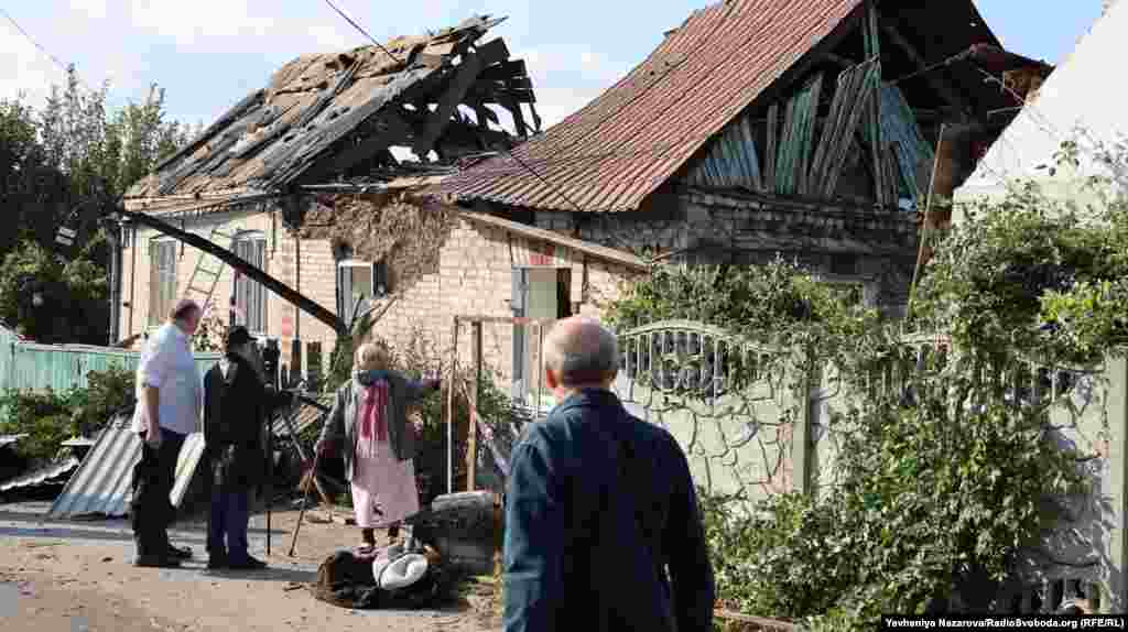  A woman stands next her house, which was destroyed by a Russian air strike. Ukraine&#39;s national police said Russia used glide bombs in three waves of attacks on&nbsp;Zaporizhzhya. &nbsp; 