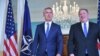 U.S. Secretary of State Mike Pompeo (right) and NATO Secretary-General Jens Stoltenberg make their way into the treaty room ahead of a bilateral meeting at the State Department in Washington, September 13, 2018