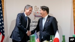 U.S. Secretary of State Antony Blinken (left) and Japanese Foreign Minister Yoshimasa Hayashi arrive for a meeting during a G7 foreign ministers' meeting at the Prince Karuizawa hotel in Karuizawa, Japan, on April 17.