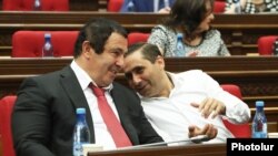 Armenia -- Prosperous Armenia Party leader Gagik Tsarukian (L) attends a parliament session in Yerevan, June 19, 2019.