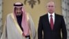 Russian President Vladimir Putin (right) and Saudi Arabia's King Salman attend a welcoming ceremony ahead of their talks in the Kremlin in Moscow on October 5.