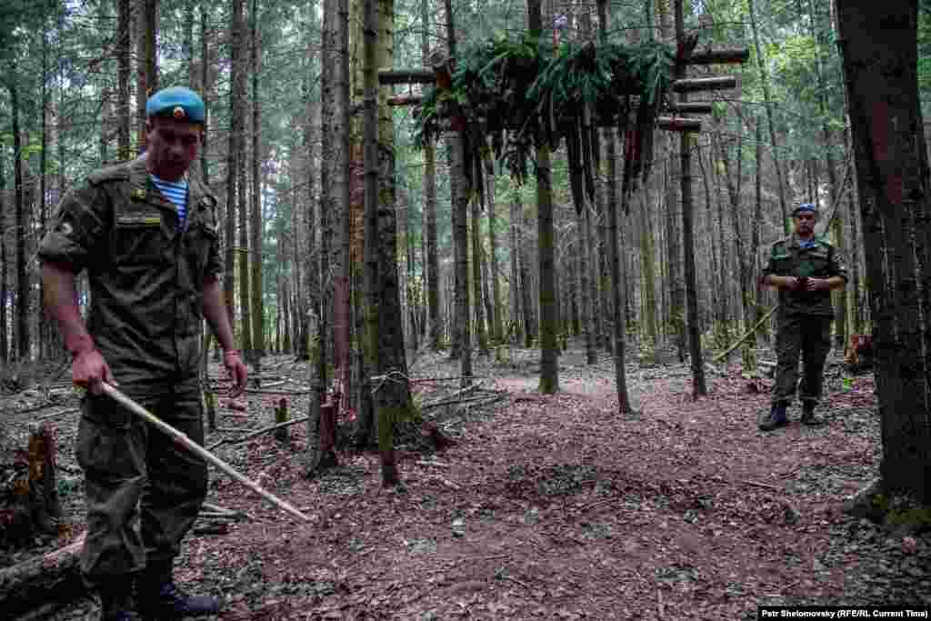 In one military demonstration, airborne marines show visitors how to build a boar trap.