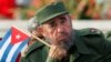 Cuba -- Cuban President Fidel Castro listens to a speaker during the May Day parade in Havana's Revolution Square, May 1, 2005