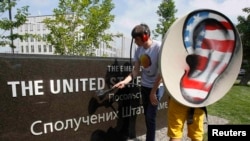 Activists from the Internet Party of Ukraine perform during a rally supporting Edward Snowden