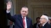 Turkey's President Tayyip Erdogan gestures to photographers at Carthage Palace in Tunis, Tunisia, December 27, 2017