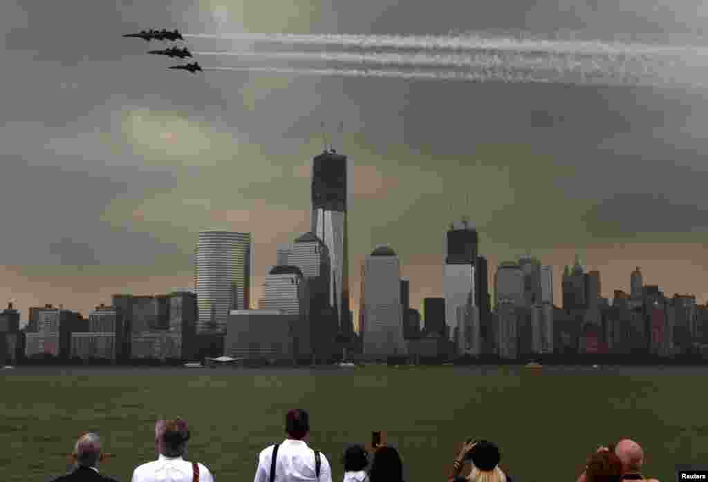 Members of the U.S. Navy Blue Angels fly over lower Manhattan as part of the 25th annual Fleet Week celebration in New York on May 23. (Reuters/Eduardo Munoz)