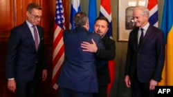 Ukraine's President Volodymyr Zelenskyy (second right) hugs US envoy Steve Witkoff, as Norway's Prime Minister Jonas Gahr Store (right) and Finnish President Alexander Stubb (left) look on during their meeting in Oslo on October 20.