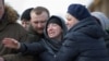 RUSSIA -- People react during a funeral of a victim of a shopping mall fire at a cemetery in Kemerovo, March 28, 2018