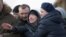 RUSSIA -- People react during a funeral of a victim of a shopping mall fire at a cemetery in Kemerovo, March 28, 2018