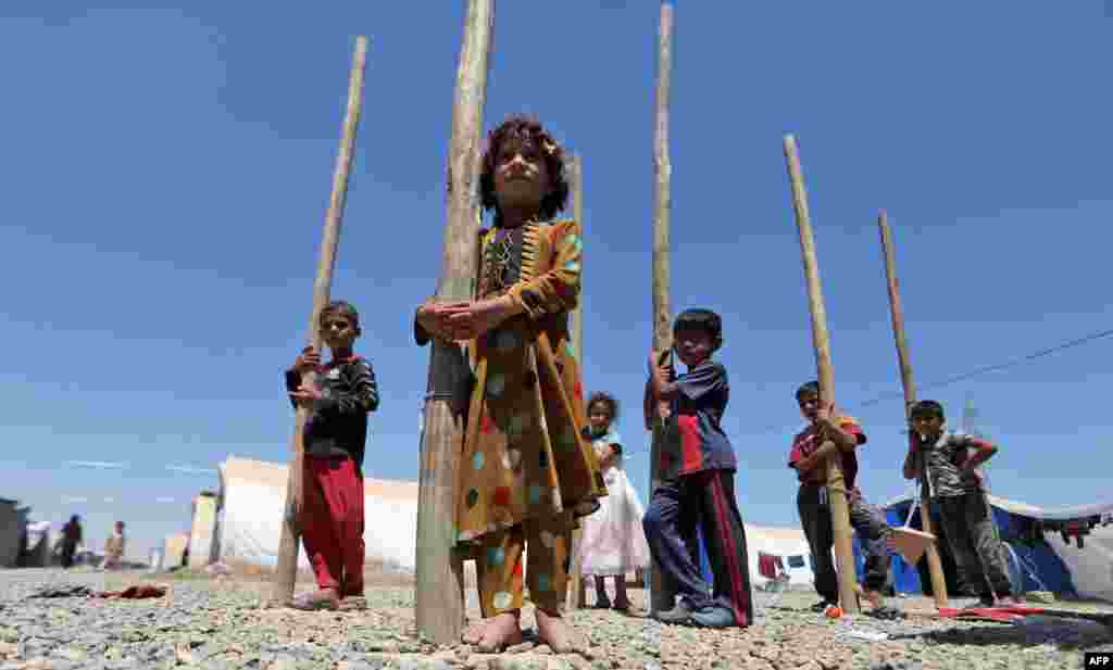 Iraqi children play at the Al-Khazir camp for the internally displaced, located between Arbil and Mosul. (AFP/Karim Sahib)