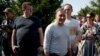 Andrey Dzmitryeu (front right), a former candidate in the 2020 Belarusian presidential election, is pictured outside a pre-trial detention facility in Zhodzina, Belarus, in September 2020.