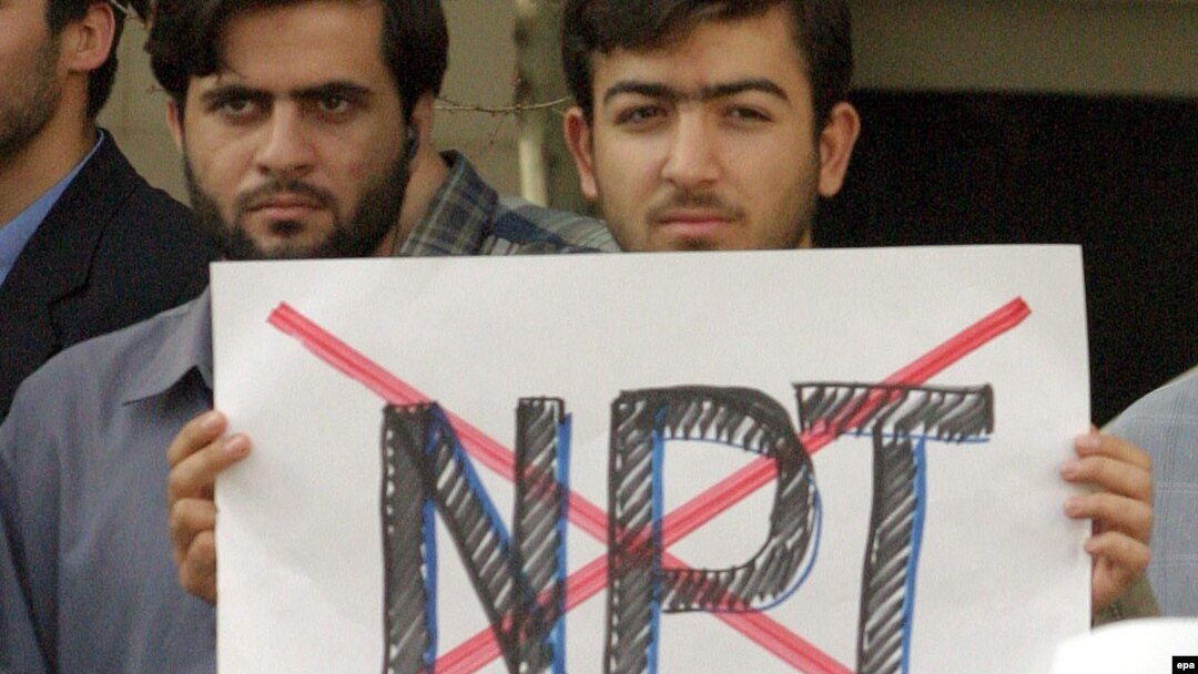 Iranians expressing anti-NPT sentiment at an Islamist-staged protest outside Tehran's presidential palace in October 2003, after Iranian officials indicated they would sign the NPT's "additional protocols." 