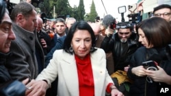 Outgoing Georgian President Salome Zourabichvili leaves the presidential palace in Tbilisi on December 29. 