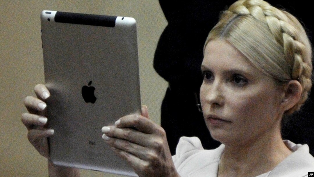 Yulia Tymoshenko uses her iPad to take a photograph during a trial hearing in Kyiv last month.