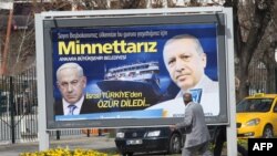 A billboard in Ankara, the Turkish capital, shows Prime Minister Recep Tayyip Erdogan (right) and his Israeli counterpart, Benjamin Netanyahu, and reads: "We are grateful to you," a reference to Netanyahu's apology.