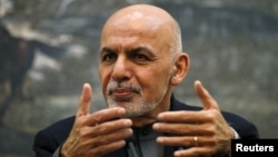 Afghan President Ashraf Ghani speaks during a news conference in Kabul on December 7