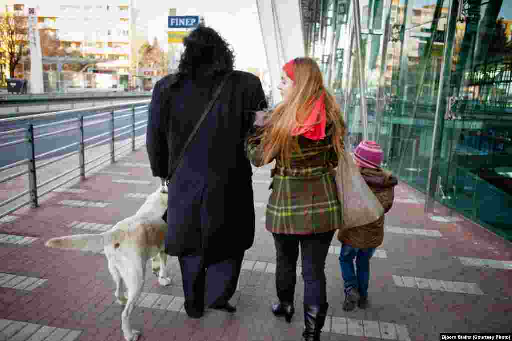Bihari and his family walk through Prague. 