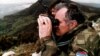 BOSNIA-HERZEGOVINA -- Bosnian Serb wartime general Ratko Mladic monitors a battle against Muslim forces near the eastern Bosnian town of Gorazde, April 16, 1994