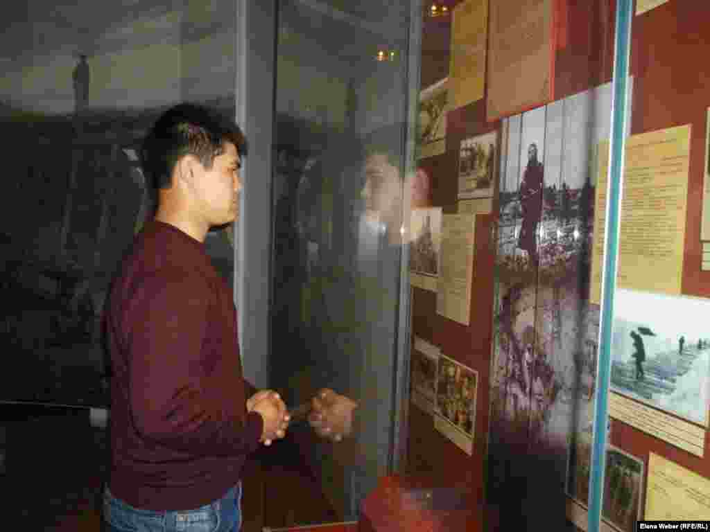 In the Hall of Remembrance, a visitor reads about those who died in the KarLAG.