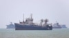 Vessels in the Strait of Hormuz near the beach of Bandar Abbas
