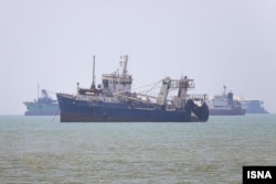 Commercial vessels sail in the Strait of Hormuz on June 24.