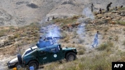 Ауғанстан қауіпсіздік күштері «Талибан» жасағымен соғысып жатыр. Нангархар провинциясы, 25 қыркүйек 2014 жыл.
