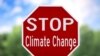 Надпіс на знаку: Спыніць зьмену клімату