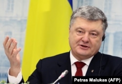 Ukrainian President Petro Poroshenko at a joint press conference with his Lithuanian counterpart Dalia Grybauskaite on December 8.