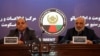 Afghan intelligence chief Masoom Stanekzai (right) and Interior Minister Wais Barmak hold a news conference in Kabul on February 1.