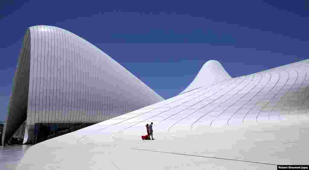 The curving lines of the Heydar Aliyev Center in downtown Baku. The complex is named after the father of Azerbaijan's current president. Azerbaijan has lived under the Aliyev family name since 1969. 