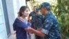 One of several undated photos of Gulnara Karimova -- apparently under house arrest and being restrained by security troops -- released in September by Ryan Locksley.