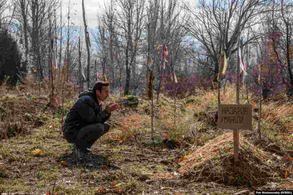 Nazar Boberov visits the grave of his great-nephew Umarali Nazarov.