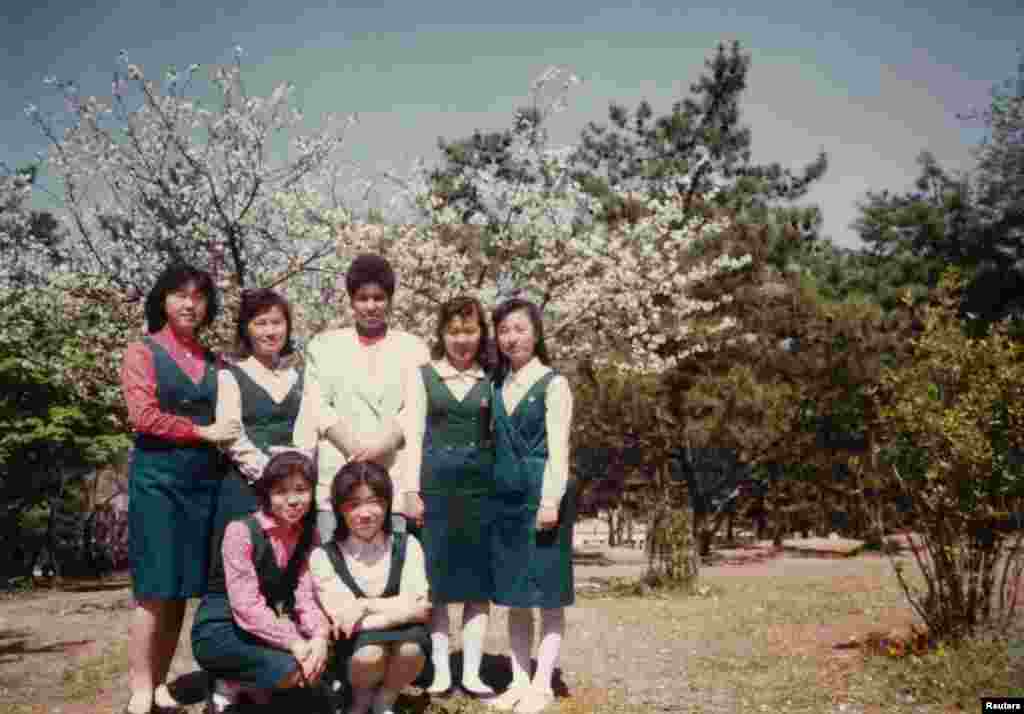 Monique (second row, center) poses with university classmates in Pyongyang in 1990.
