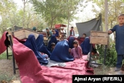 Afghans who have been displaced by the fighting in neighboring Kunduz Province.