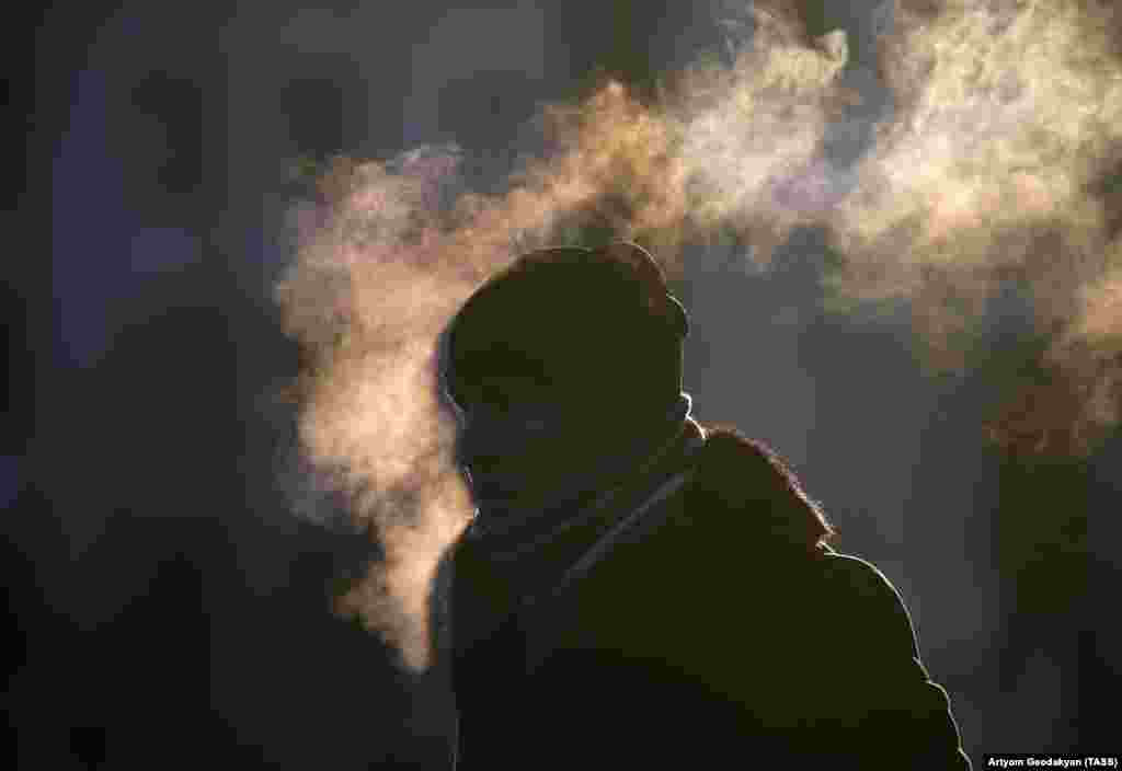 A man walks in frosty weather in Moscow, where the temperature dropped below -19 degrees Celsius. (TASS/Artyom Geodakyan)